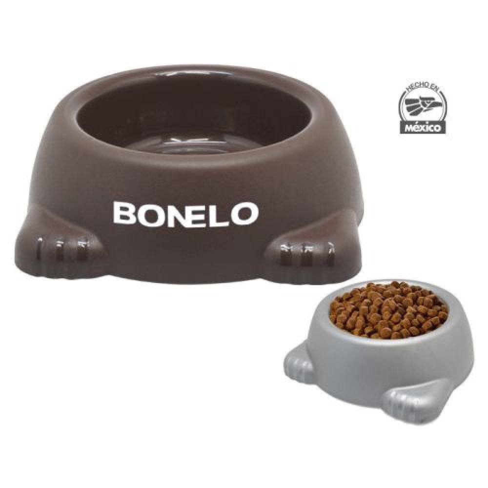 RECIPIENTE PARA MASCOTAS HUELLITAS   Recipiente de alimentos para mascotas, con detalle de patitas y gomas antideslizantes en la base. Cuenta con un orificio de fácil agarre. Cap. 950 ml. imagen