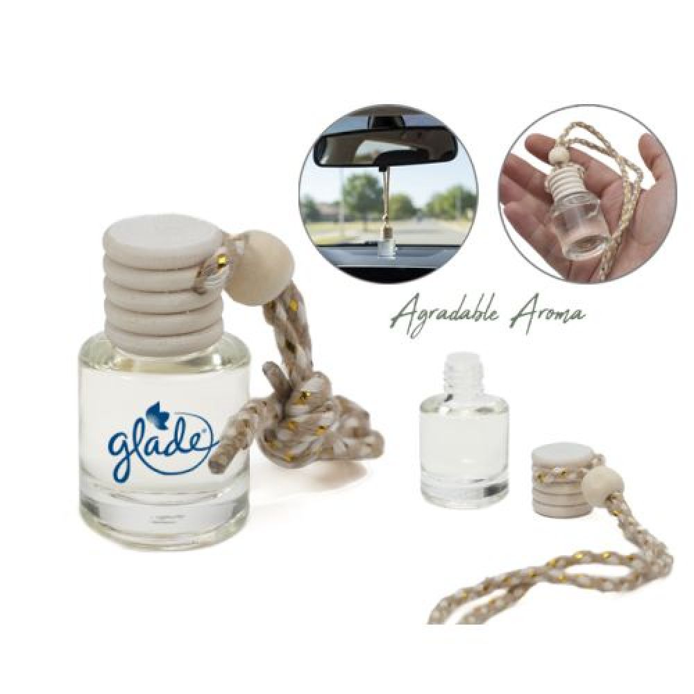 Botella difusora de vidrio de 5 ml. con fragancia; la tapa de madera se impregna desprendiendo el aroma contenido. Ideal para coches, closets o lugares pequeños. Cuenta con cinta ajustable para colgarse. Fragancia incluida. Presentación: Caja individual. imagen