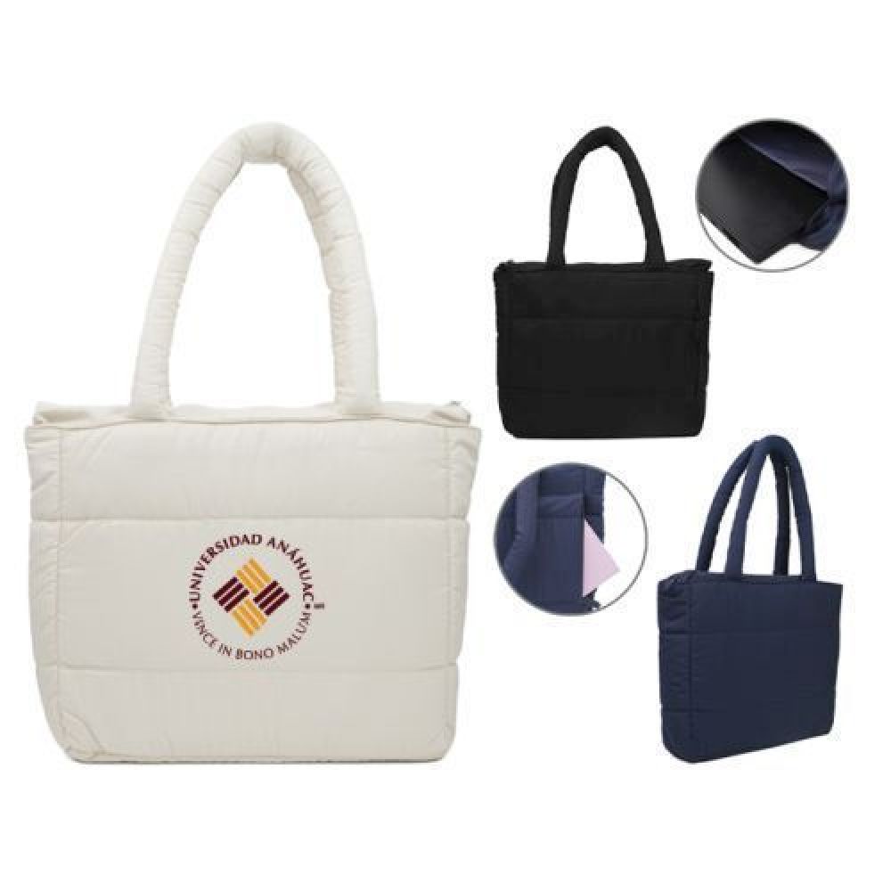 Bolsa acolchada repelente al agua, con cierre central, forro interior, área acolchada para laptop de hasta 15\. El exterior cuenta con discreta bolsa frontal con cierre lateral y dos asas acolchadas imagen